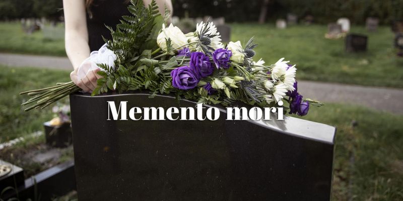 Bild på en gravsten med texten memento-mori